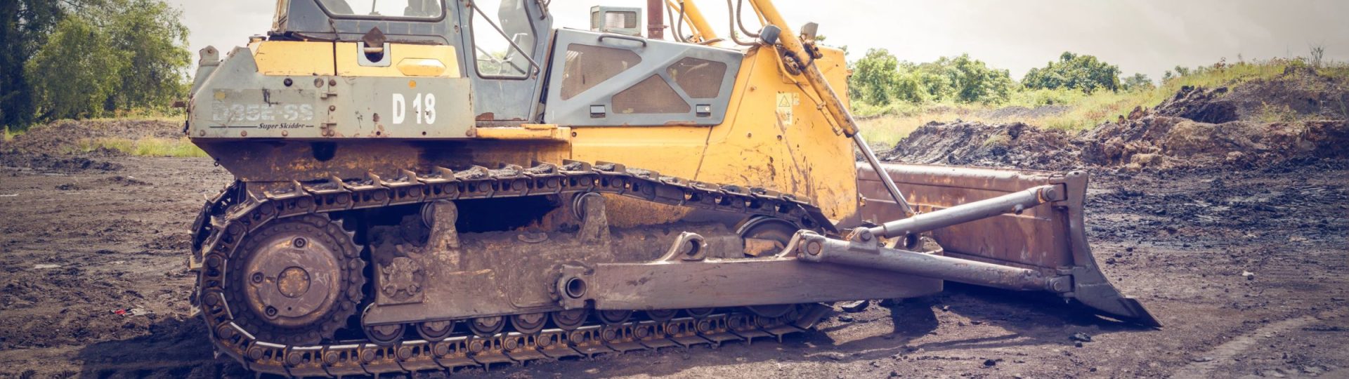 Crawler dozer and its tracks on a dirt site